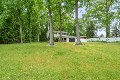 Situated on a double wooded lot directly across from Long Lake - photo 2