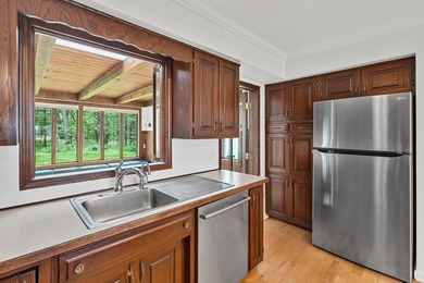 Situated on a double wooded lot directly across from Long Lake - photo 8