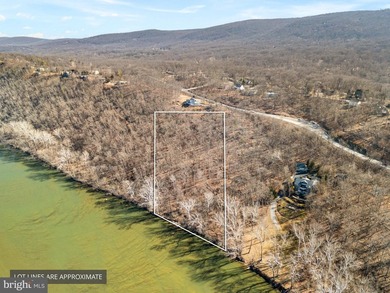 Discover the potential of this 4.9+/- acre waterfront parcel on - photo 1