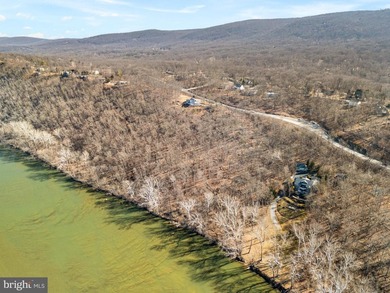 Discover the potential of this 4.9+/- acre waterfront parcel on - photo 2