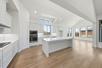 This popular open-concept home features a dramatic vaulted - photo 11