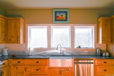 Situated on the banks of the beautiful, clear Caddo River, this - photo 16