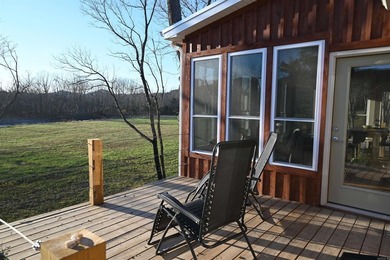 Situated on the banks of the beautiful, clear Caddo River, this - photo 32