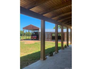 Situated on the banks of the beautiful, clear Caddo River, this - photo 36