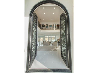 Step into this European-inspired lakefront masterpiece, built in - photo 3
