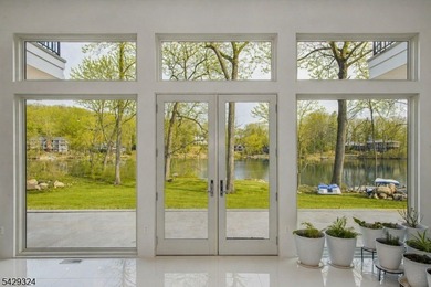Step into this European-inspired lakefront masterpiece, built in - photo 7