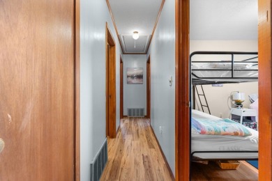 This solid 3 bedroom ranch sits on over an acre of rolling