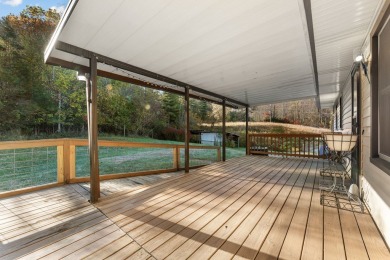 This solid 3 bedroom ranch sits on over an acre of rolling