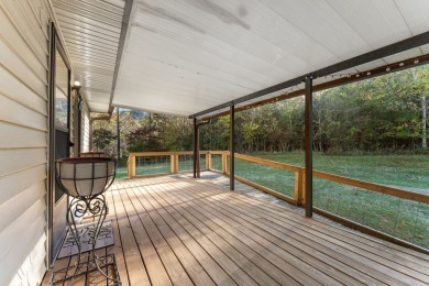 This solid 3 bedroom ranch sits on over an acre of rolling