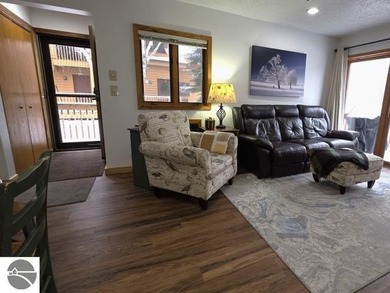 Comfortable in all seasons, this 2-bedroom condominium has