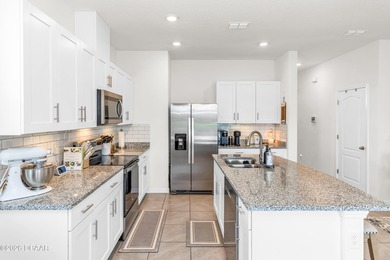 Welcome to this low-maintenance end-unit townhome featuring 3 - photo 5