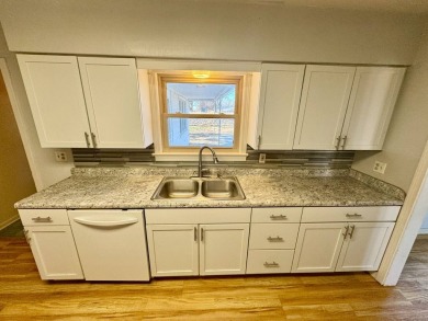 This 4-bedroom, 2-bathroom home, situated on a hilltop, offers