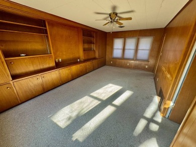 This 4-bedroom, 2-bathroom home, situated on a hilltop, offers