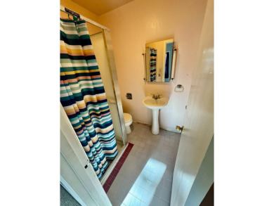 This 4-bedroom, 2-bathroom home, situated on a hilltop, offers