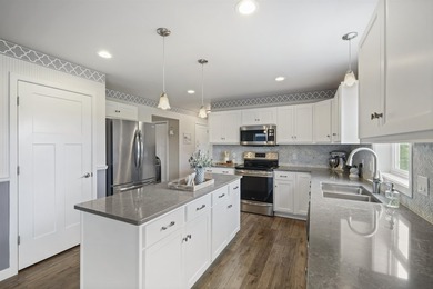 This beautifully maintained two-story home welcomes you with an - photo 4