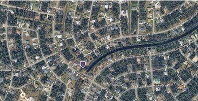 This buildable lot, equipped with city water, is situated in a - photo 4
