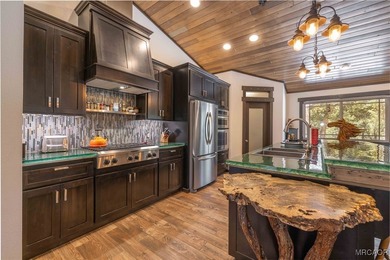 This breathtaking custom Craftsman home is tucked away on a - photo 16