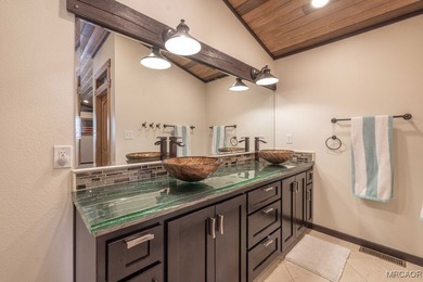 This breathtaking custom Craftsman home is tucked away on a - photo 21
