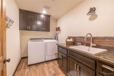 This breathtaking custom Craftsman home is tucked away on a - photo 37