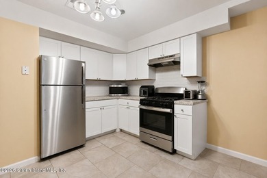 Welcome home to this exceptional two-family residence nestled in - photo 30