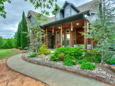 Nestled on approximately 4 private, wooded acres, this - photo 1