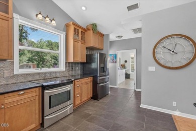Picturesque Creekfront Farmhouse on 5.03 fully fenced acres! - photo 10