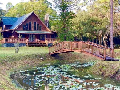AWESOME Log Home with wrap around porch sitting on 10 Acres of - photo 1