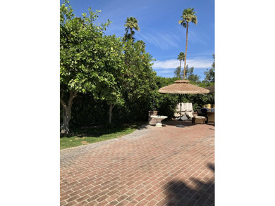 This desirable corner lot features a beautifully brick paved - photo 1