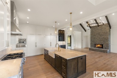 Nestled within the gates of Wildcat Cliffs Country Club but part