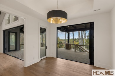 Nestled within the gates of Wildcat Cliffs Country Club but part