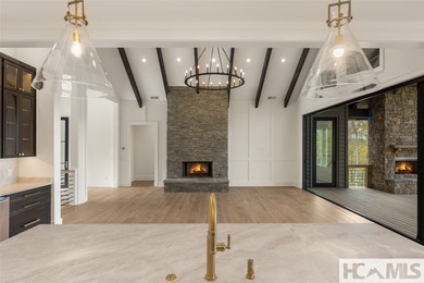 Nestled within the gates of Wildcat Cliffs Country Club but part