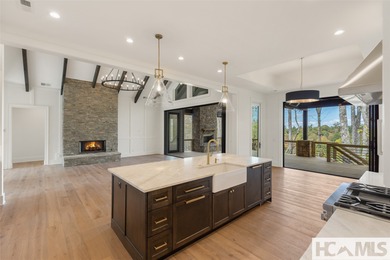 Nestled within the gates of Wildcat Cliffs Country Club but part