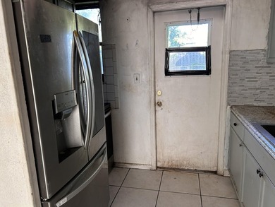 The kitchen appears to have experienced a stovetop fire - photo 12