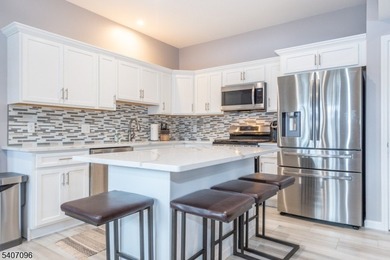 Experience elevated lakefront living in this stylish townhouse - photo 1