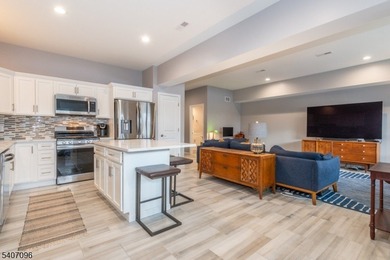 Experience elevated lakefront living in this stylish townhouse - photo 3