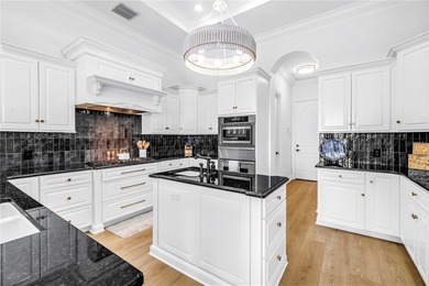 Welcome to one of Tampa Bay's most coveted gated waterfront