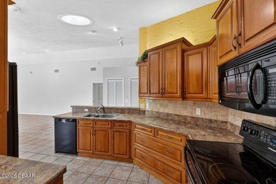 This exquisitely updated 5-bedroom, 3 bath residence with a - photo 11
