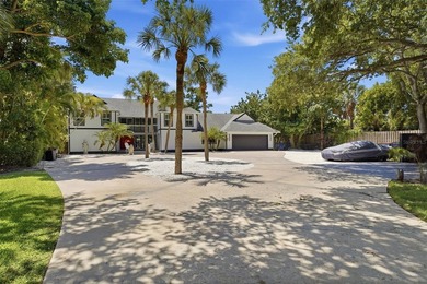 Hidden behind an expansive 250-foot circular driveway, the - photo 2