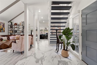 Hidden behind an expansive 250-foot circular driveway, the - photo 5