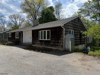 Welcome to this spacious four-bedroom ranch nestled in the - photo 2