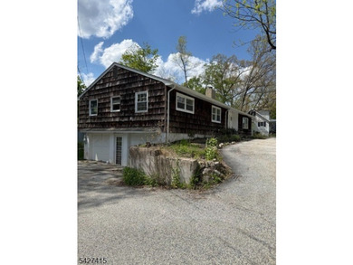 Welcome to this spacious four-bedroom ranch nestled in the - photo 3