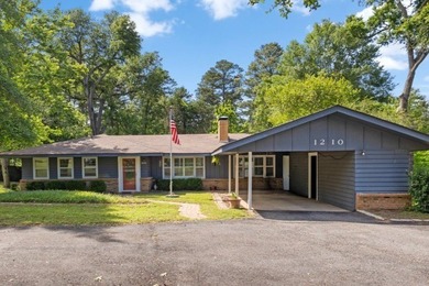 This well-maintained 3-bedroom, 2-bath home is nestled on a - photo 1