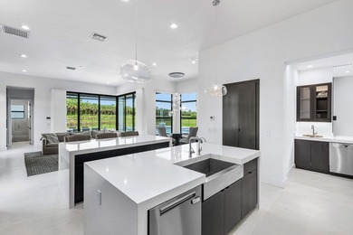 Nestled behind the prestigious gates of Boca Bridges, this - photo 14