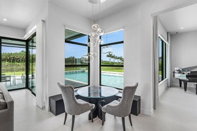 Nestled behind the prestigious gates of Boca Bridges, this - photo 16