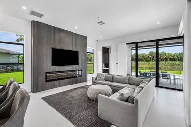 Nestled behind the prestigious gates of Boca Bridges, this - photo 18