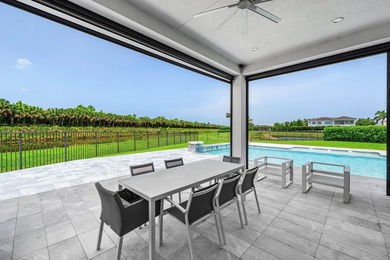 Nestled behind the prestigious gates of Boca Bridges, this - photo 37