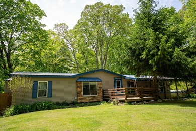 Nestled along the beautiful Muskegon River, this charming 2-bd - photo 1