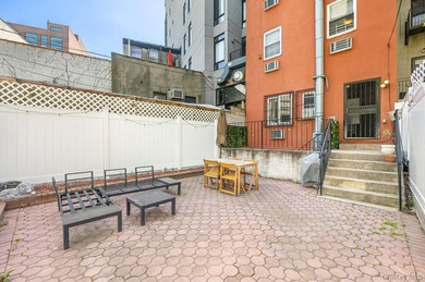 Welcome to 41 Claver Place, a remarkable three-family townhouse - photo 10