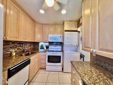 Welcome to this charming two-bedroom, two-bathroom condominium - photo 11
