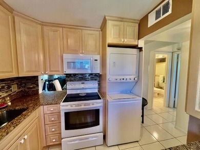 Welcome to this charming two-bedroom, two-bathroom condominium - photo 13